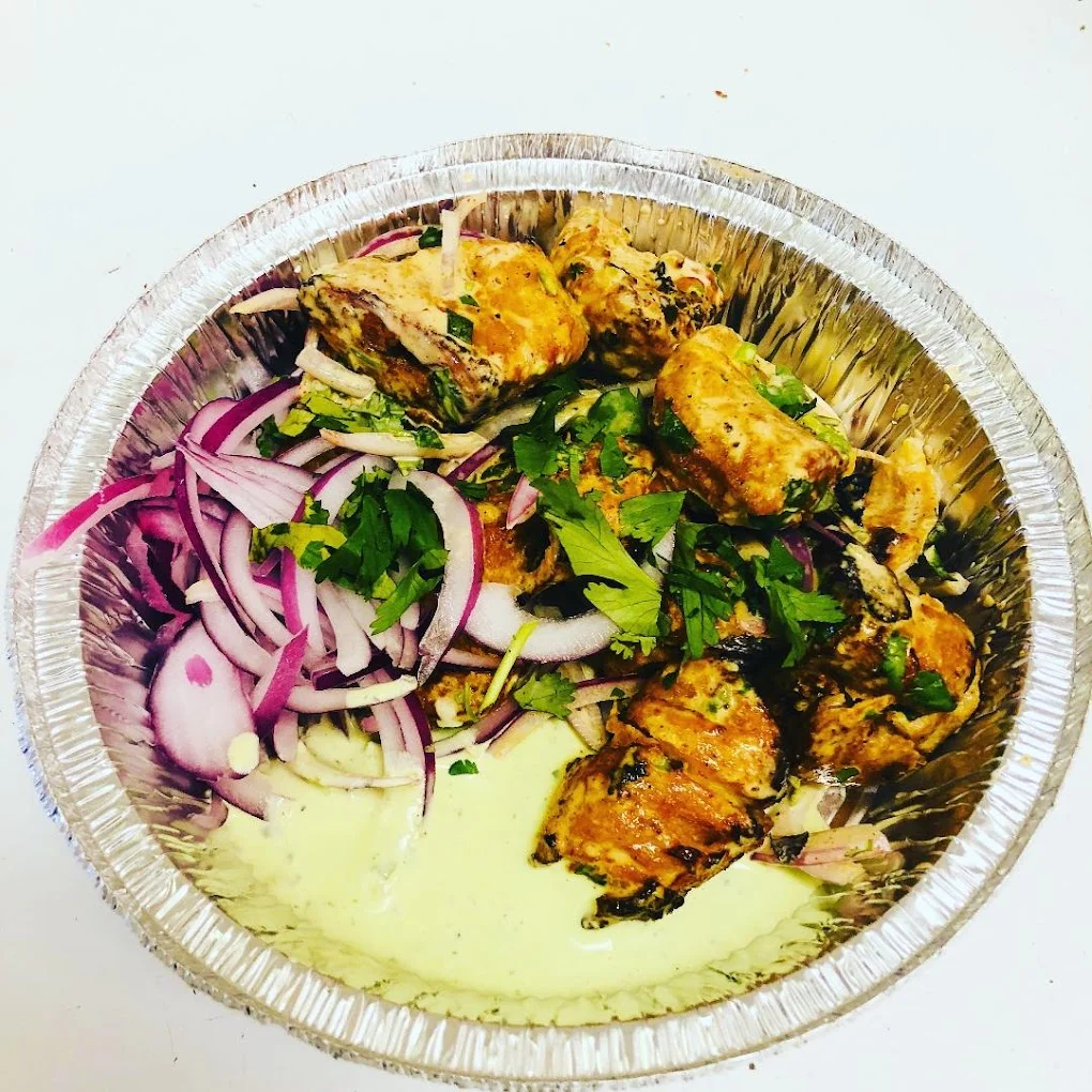 Indian-style pizza and desi wings at Delicious Pizza N Wings McPhillips Street